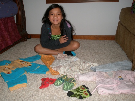 Kasen with her clothes from 8 years ago